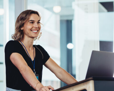 Businesswoman standing at podium