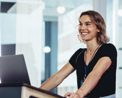 Businesswoman standing at podium