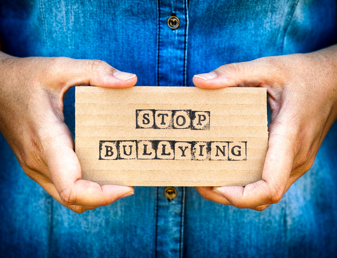 to hands holding a sign that says 