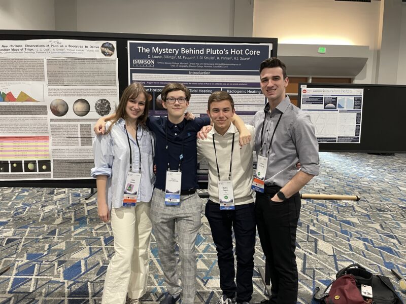 group photo of students in front of their booth