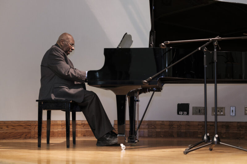 Photo of Oliver Jones playing the piano at Dawson