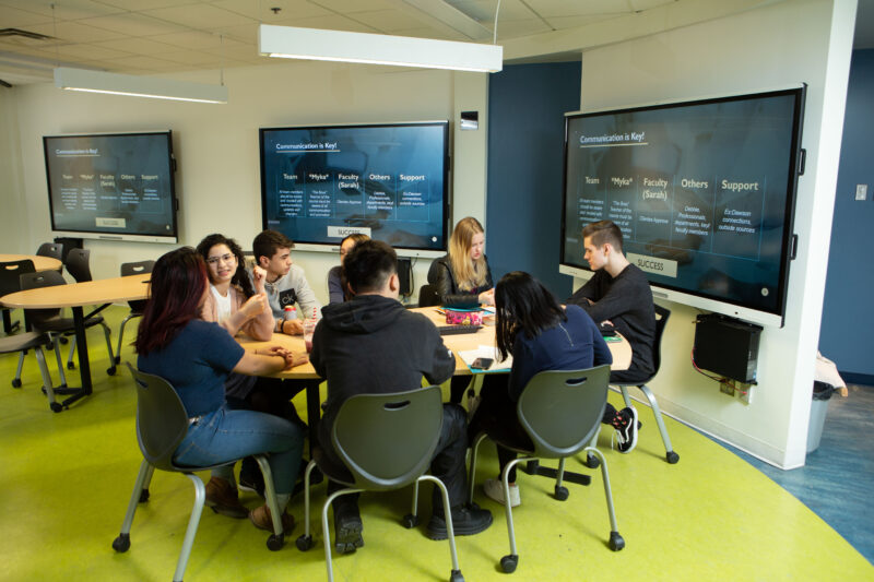 Students in an active learning classroom at Dawson