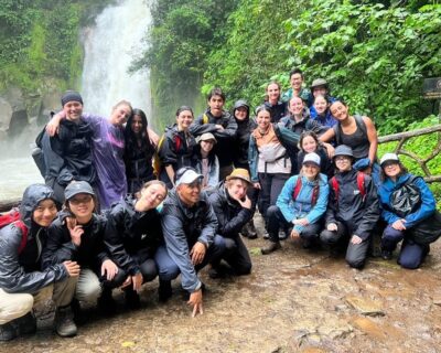 Group in Costa Rica in front of waterfall by Danika Belzile