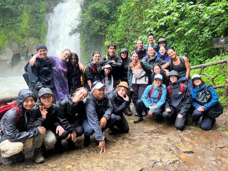 Group in Costa Rica in front of waterfall by Danika Belzile