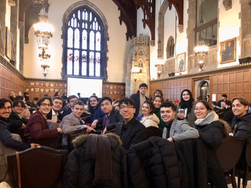 DCMUN delegates attending the 2023 N.A.M.U.N. closing ceremonies at the Great Hall in Hart House, University of Toronto.