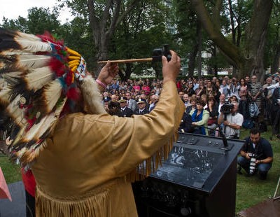MONTREAL, QUE: SEPTEMBER 13, 2011 - On the fifth anniversary of the shooting at Dawson College, the college inaugurated an "Ecological Peace Garden" in Montreal on Tuesday, September 13, 2011. The peace garden is meant as a living memorial to Anastasia De Sousa, the 18-year-old student who was killed and to the courage of those affected by the tragedy. Chief Dominick Rankin presents the peace pipe to four directions, north, east, west and south. (Dave Sidaway / THE GAZETTE)