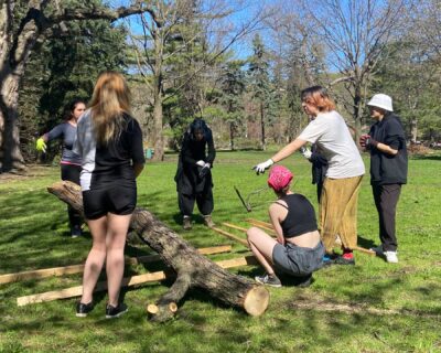 Students using tree for landscaping