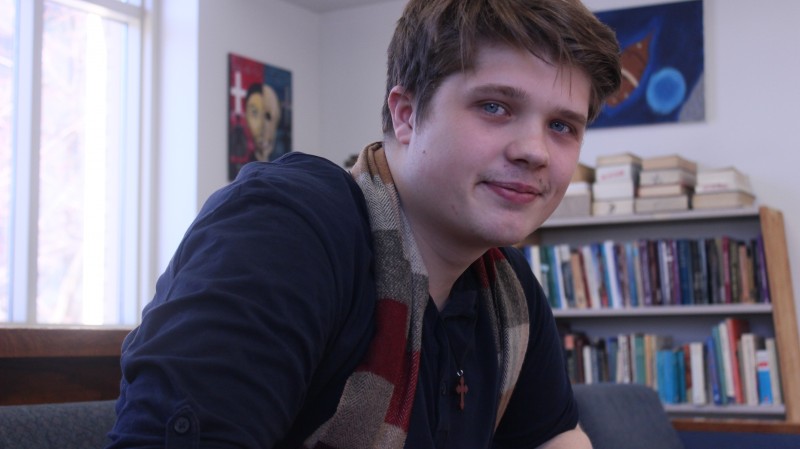 Student Peter Sitting in Reflections 